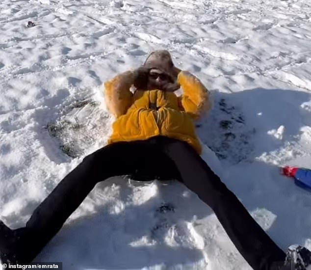 In a clip, Ratajkowski made a snow angel while laying on the snow while her son did the same next to her