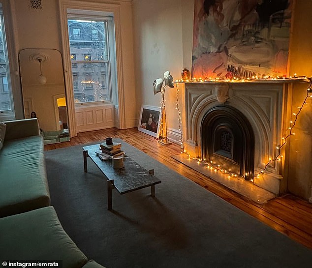 She also gave her followers a glimpse of her apartment, including the living room which had lights wrapped around the fireplace