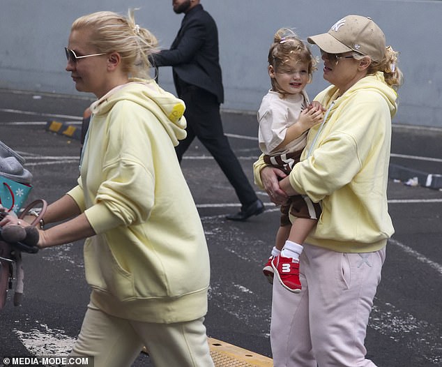 Choosing to tie her hair back for the occasion, Ramona ditched the accessories, too, save for her matching sunglasses