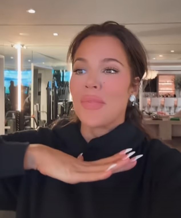 The Keeping Up with the Kardashians star updated more than 305 million followers of her holiday goings-on while exercising in a black hoodie