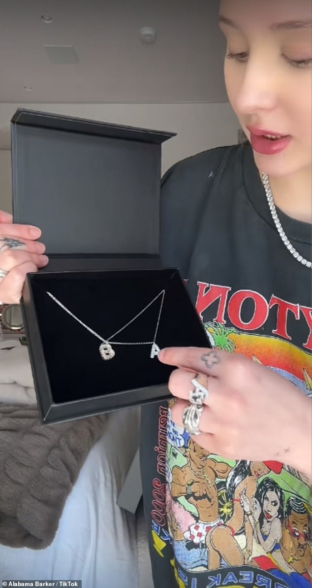 The diamond necklace above featuring her initials was a gift from her sister