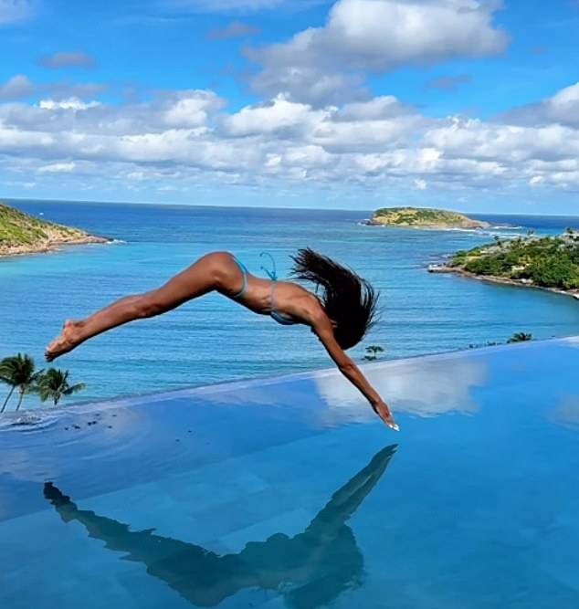 The star dove into the swimming pool at her hillside resort in St Barts in the Caribbean. She first pushed off on the side of the pool, then went in the water arms first