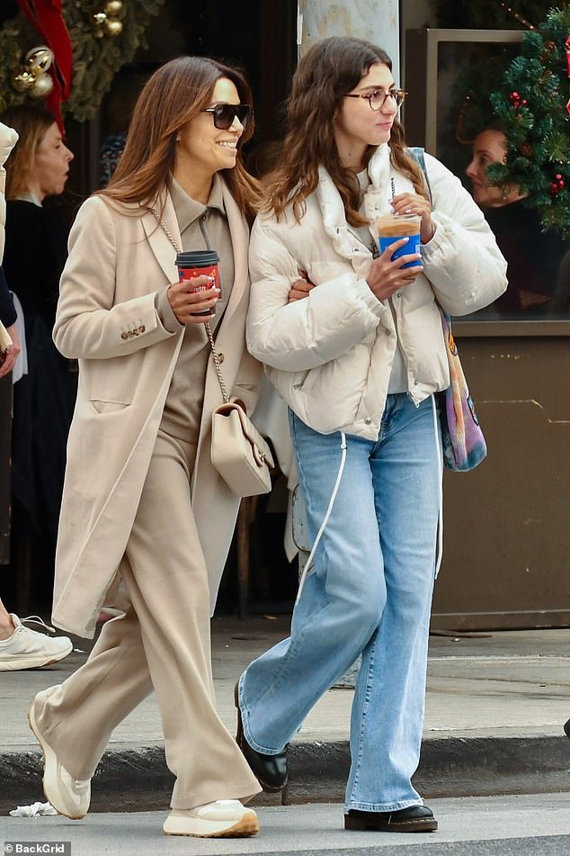 Eva Longoria cut a stylish figure in a beige coat as she enjoyed a shopping trip with her stepdaughter Mariana Bastón in Beverly Hills on Friday