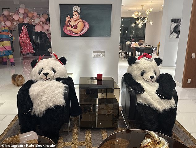 She also shared a picture of two giant panda teddies that were wearing Christmas hats and seated on her furniture