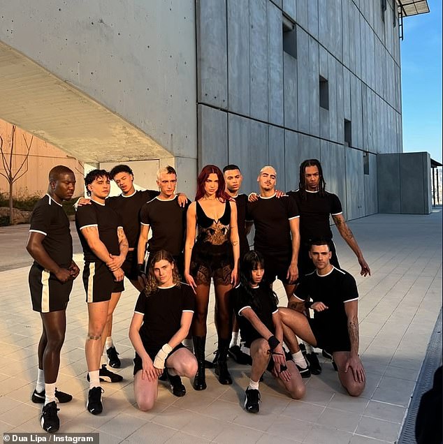 One of the pictures showed her posing with her dancers as she rehearsed for her Radical Optimism Tour which began at the beginning of November