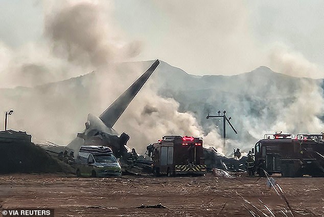 Pictures from the scene show the tail of the aircraft surrounded by debris with smoke coming out of it as firefighters tackle the blaze