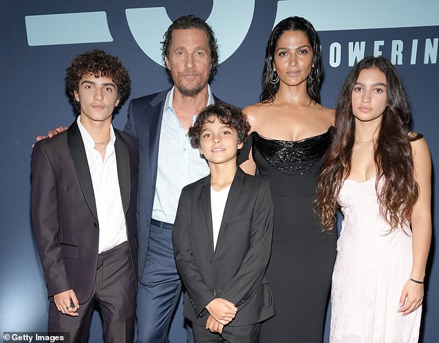 The 55-year-old Oscar winner took to Instagram on Saturday, posting two heartwarming snapshots of their father-son bonding at a University of Texas football game—McConaughey’s alma mater; ((L-R) Levi McConaughey, Matthew McConaughey, Livingston McConaughey, Camila Alves McConaughey and Vida McConaugheyin April 2024)