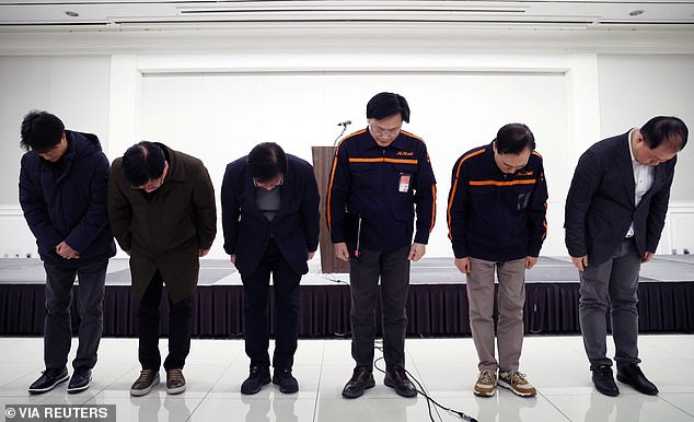 Jeju Air CEO Kim E-bae and officials bow to apologise for their plane's incident at Muan International Airport as they hold a press conference in Seoul, South Korea