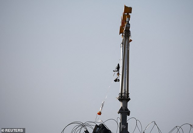 An oxygen mask hangs from a post at the site where the aircraft crashed at Muan International Airport - December 29, 2024