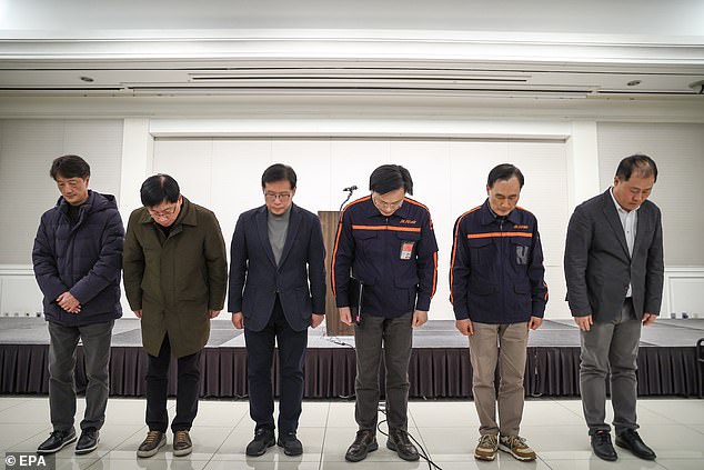 Jeju Air CEO Kim E-bae (C-R) and other company officials express their apologies ahead of a press conference held in Seoul, South Korea, 29 December 2024, hours after the deadly crash of one of its flights