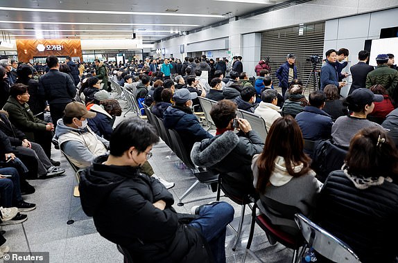 Relatives of passengers of the aircraft that crashed after it went off the runway, gather at Muan International Airport, in Muan, South Korea, December 29, 2024. REUTERS/Kim Soo-hyeon