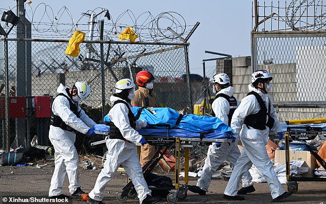 Rescuers operate at the site of an airplane crash at the Muan International Airport, some 290 km southwest of Seoul, South Korea, Dec. 29, 2024