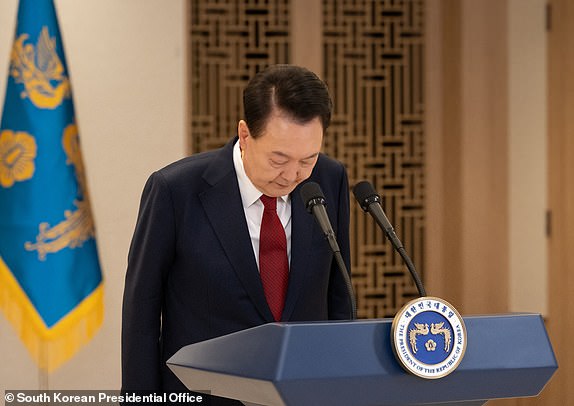 (FILES) This handout photo taken on December 12, 2024 and released by the South Korean Presidential Office shows South Korea's President Yoon Suk Yeol bowing while delivering an address at the Presidential Office in Seoul. After South Korea's president and his replacement were both deposed over a failed bid to impose martial law, deepening political turmoil is threatening the country's currency and shaking confidence in its economy. (Photo by Handout / South Korean Presidential Office / AFP) / RESTRICTED TO EDITORIAL USE - MANDATORY CREDIT "AFP PHOTO / SOUTH KOREAN PRESIDENTIAL OFFICE" - NO MARKETING NO ADVERTISING CAMPAIGNS - DISTRIBUTED AS A SERVICE TO CLIENTS To go with ' SKOREA-POLITICS-ECONOMY-IMPEACHMENT, ANALYSIS' by Roland DE COURSON (Photo by HANDOUT/South Korean Presidential Office/AFP via Getty Images)