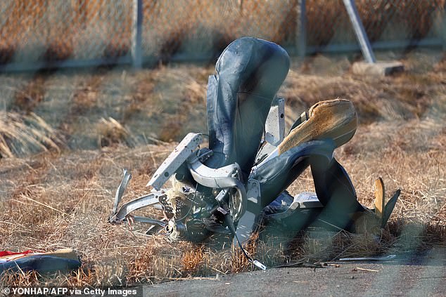 The remains of a passenger seat lies on the ground after a Jeju Air Boeing 737-800 series aircraft crashed and burst into flames at Muan International Airport