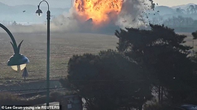 The grim moment the plane burst into flames after smashing into a concrete wall at the end of the runway