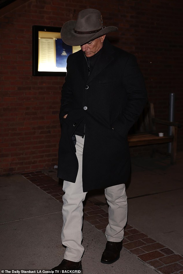 Jeff - who will soon wed fiancée Lauren Sánchez - bundled up in a large grey cowboy hat, long black coat over a matching top, off-white jeans, and black shoes