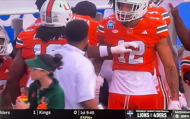 Two Miami football players exchanged blows during the Pop-Tarts Bowl on Saturday