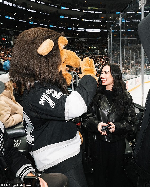 The Kings mascot Bailey made a big deal out of Demi, hugging her, posing for photos with her, and calling Demi his #1 fan in a later Instagram post