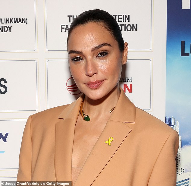 On Sunday, Gal Gadot revealed she quietly underwent surgery last March to repair a blood clot in her brain shortly after giving birth to her fourth child (pictured November 13)