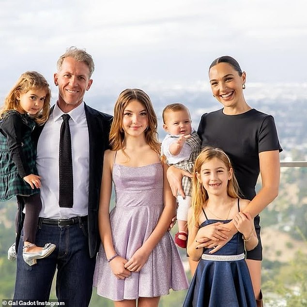 Miss Israel 2004 and her 47-year-old Pilot Wave producing partner are proud parents of four daughters - Alma, 13; Maya, 7; Daniella, 3; and Ori, 9 months (pictured November 9)