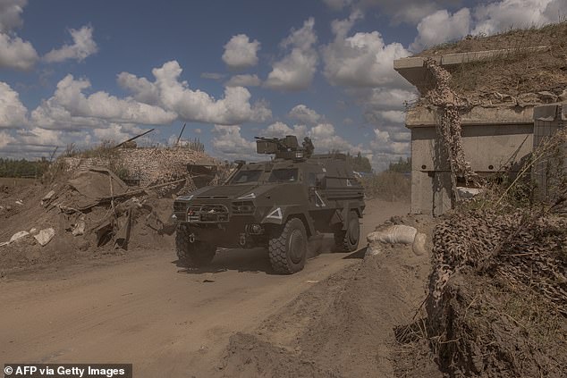 A Ukrainian military vehicle driving past a destroyed border crossing point with Russia in the Kursk region. Russia has recaptured at least half the territory and is sending thousands more troops to the region