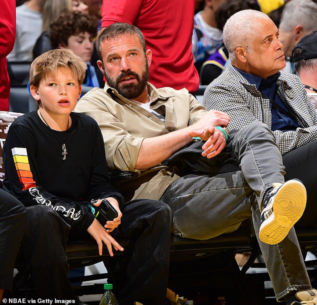 While Lopez spent Christmas with her family in Aspen, Colorado, Affleck spent it with Garner and their children according to People; seen with son Samuel, 12, in November