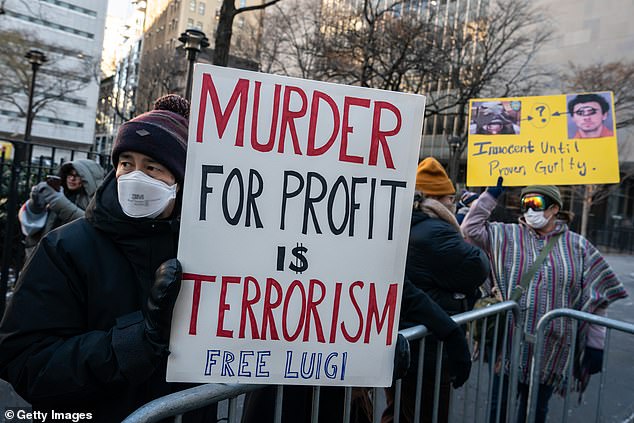 Protestors beared signs outside of Manhattan Criminal Court urging for Mangione's freedom