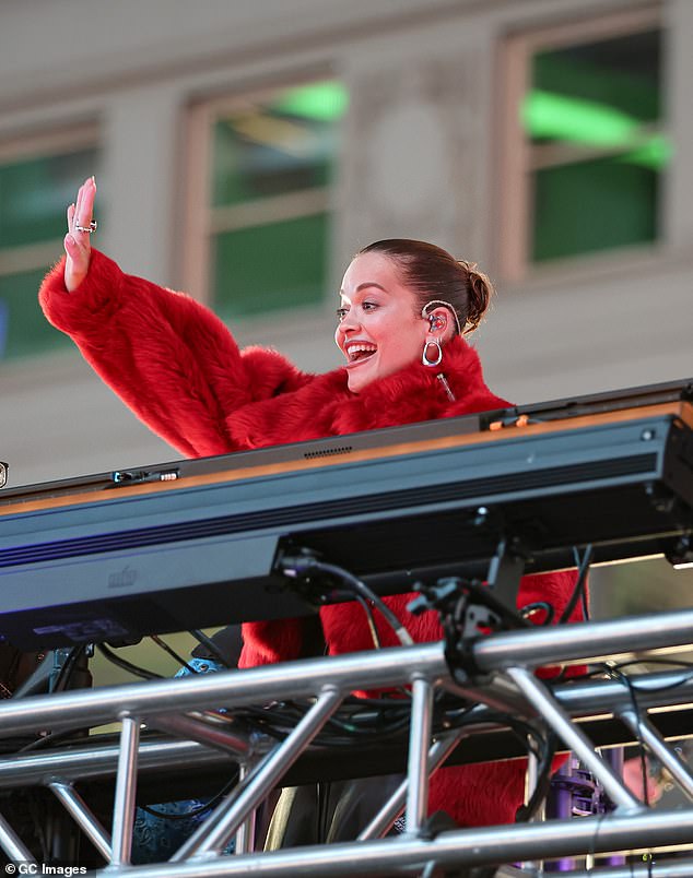 Rita waves to fans