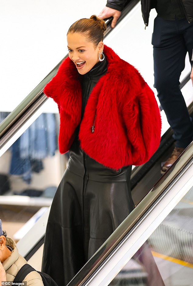 She paired her leather look with a pair of matching chunky boots and slicked her brunette locks back into a tiny bun