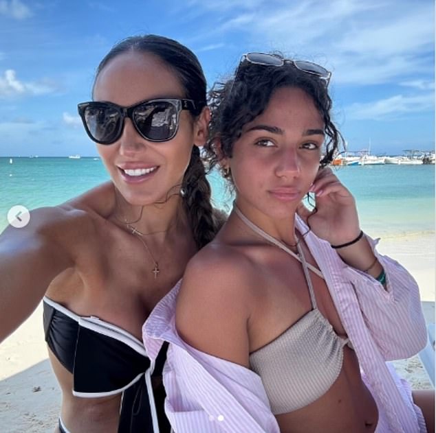 Here she was seen with her mini-me daughter who had on a beige bikini top