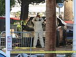 An investigator photographs the Tesla Cybertruck that exploded outside Trump International Hotel in Las Vegas