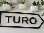 FILE - The Turo logo is shown in the entryway of Turo in San Francisco, April 29, 2019. (AP Photo/Eric Risberg, File)