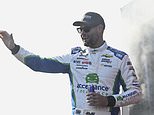 FILE - Shane van Gisbergen waves to fans prior to a NASCAR Cup Series auto race at Darlington Raceway, Sept. 1, 2024, in Darlington, S.C. (AP Photo/Matt Kelley, File)