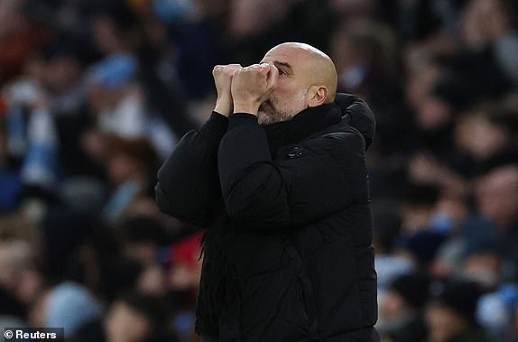 Soccer Football - Premier League - Manchester City v West Ham United - Etihad Stadium, Manchester, Britain - January 4, 2025 Manchester City manager Pep Guardiola celebrates after Erling Haaland scores their second goal REUTERS/Phil Noble EDITORIAL USE ONLY. NO USE WITH UNAUTHORIZED AUDIO, VIDEO, DATA, FIXTURE LISTS, CLUB/LEAGUE LOGOS OR 'LIVE' SERVICES. ONLINE IN-MATCH USE LIMITED TO 120 IMAGES, NO VIDEO EMULATION. NO USE IN BETTING, GAMES OR SINGLE CLUB/LEAGUE/PLAYER PUBLICATIONS. PLEASE CONTACT YOUR ACCOUNT REPRESENTATIVE FOR FURTHER DETAILS..