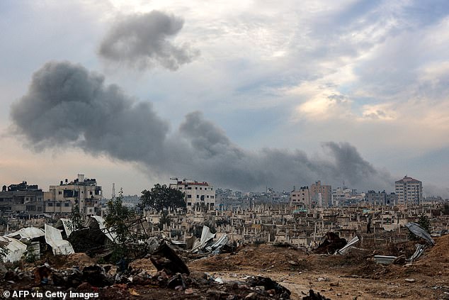 Smoke plumes billow during Israeli bombardment in the Saraya area in al-Rimal in central Gaza City on January 4