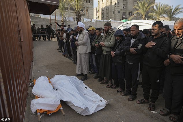 Palestinians attend funeral prayers for two of the ten people killed in overnight Israeli airstrikes on the Khan Younis refugee camp