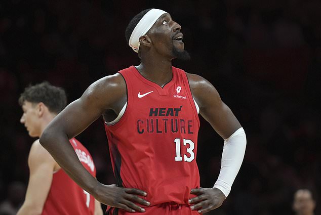 Miami Heat center Bam Adebayo (13) looks up at the scoreboard during the second half of an NBA basketball game against the Utah Jazz, Saturday, Jan. 4, 2025, in Miami. (AP Photo/Lynne Sladky)