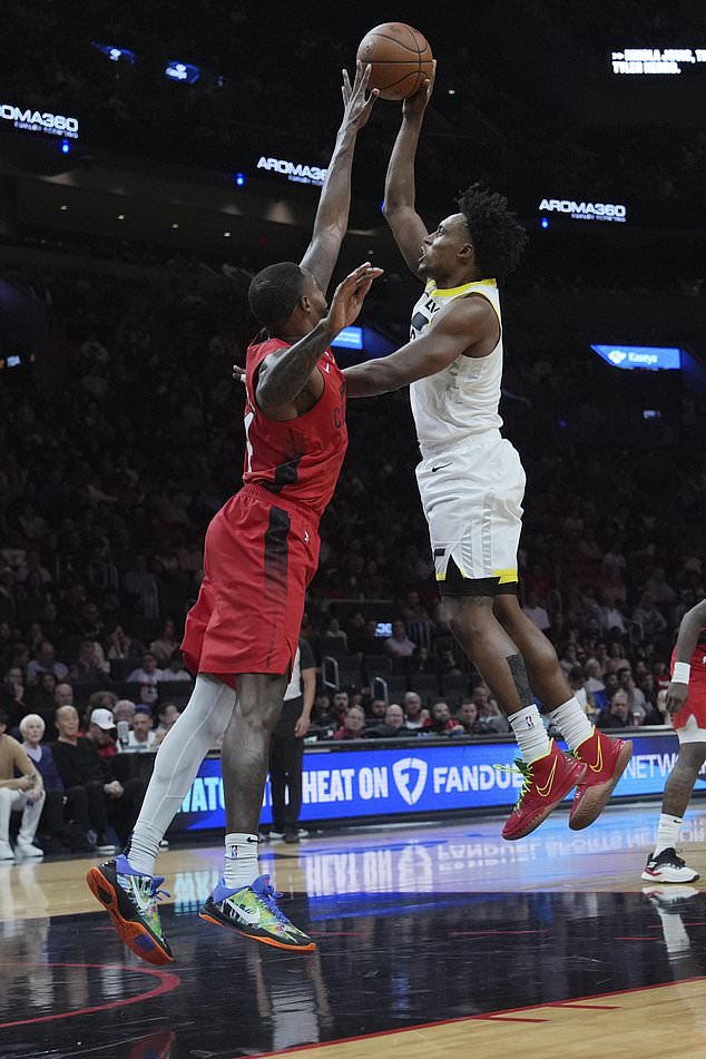 Utah Jazz forward Brice Sensabaugh, right, shoots as Miami Heat forward Haywood Highsmith, left, defends during the second half of an NBA basketball game Saturday, Jan. 4, 2025, in Miami. (AP Photo/Lynne Sladky)