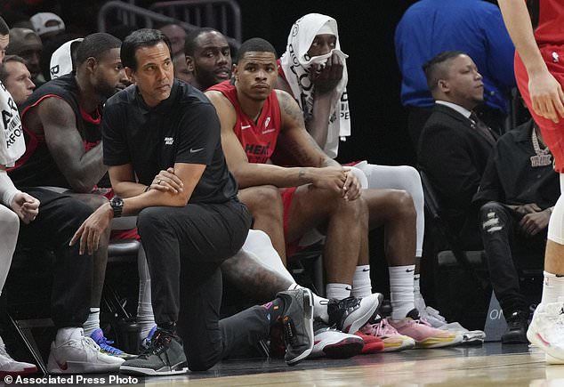 Miami Heat head coach Erik Spoelstra, front left, watches the second half of an NBA basketball game against the Utah Jazz, Saturday, Jan. 4, 2025, in Miami. (AP Photo/Lynne Sladky)