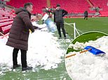 Gary Neville hilariously tries to get Man United's trip to Anfield cancelled by shovelling snow back ON the pitch amid fears of Liverpool thrashing