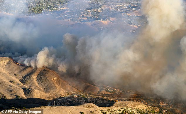 A new apocalyptic, fast-moving inferno, named the Kenneth Fire , is threatening to rip through the desirable neighbourhoods (pictured the Calabasas area where the Karashian's reside)