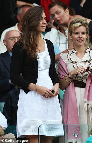 Kate Middleton at Wimbledon wearing a crisp white    Issa dress as she watched Andy Murray in 2008