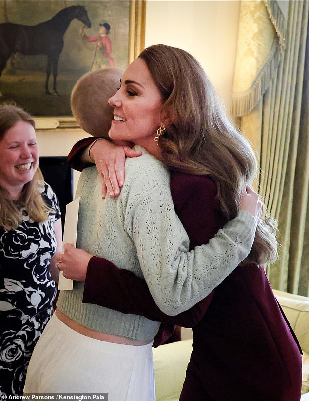 October 2, 2024 -- Kate hugs aspiring photographer Liz Hatton, who had cancer, after inviting her to take pictures at William's Windsor Castle investiture. The girl died eight weeks later