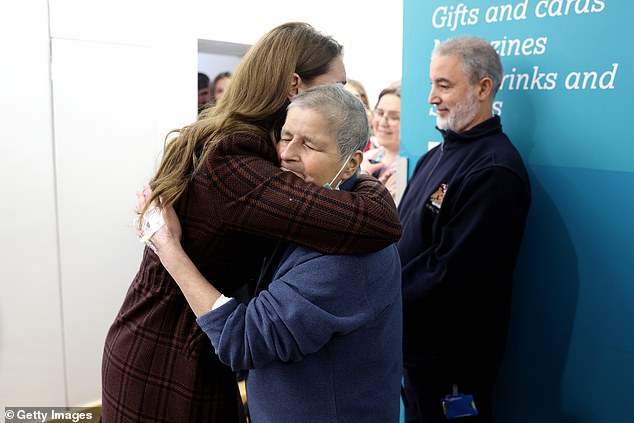 The Princess of Wales hugs patient Rebecca Mendelhson at the Royal Marsden Hospital today