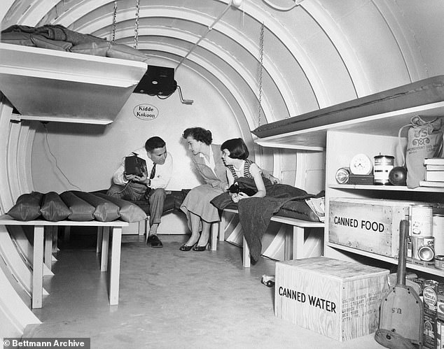 A family tests out a Cold-war era nuclear bomb blast bunker in May 1955 that contains survival gear, food and water