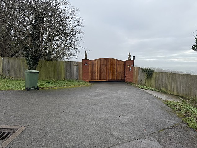 The front of the mansion behind a locked gate. The TV star had lived in the lavish property from 1999 until his death