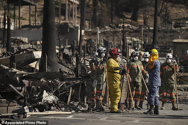 Search and rescue crews inspected a mobile home park destroyed by the Palisades Fire Wednesday