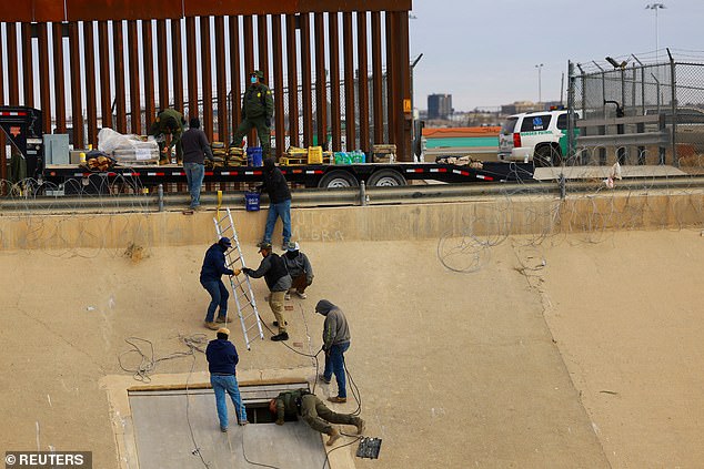 U.S. Border Patrol agents and workers use concrete to seal an illegal tunnel crossing the U.S.-Mexico border, as seen from Ciudad Juarez, Mexico, January 16, 2025