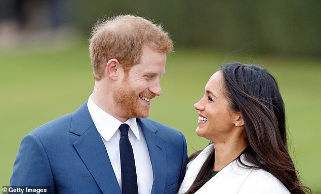 Prince Harry and Meghan Markle attend an official photo call to announce their engagement at The Sunken Gardens in Kensington Palace in November 2017