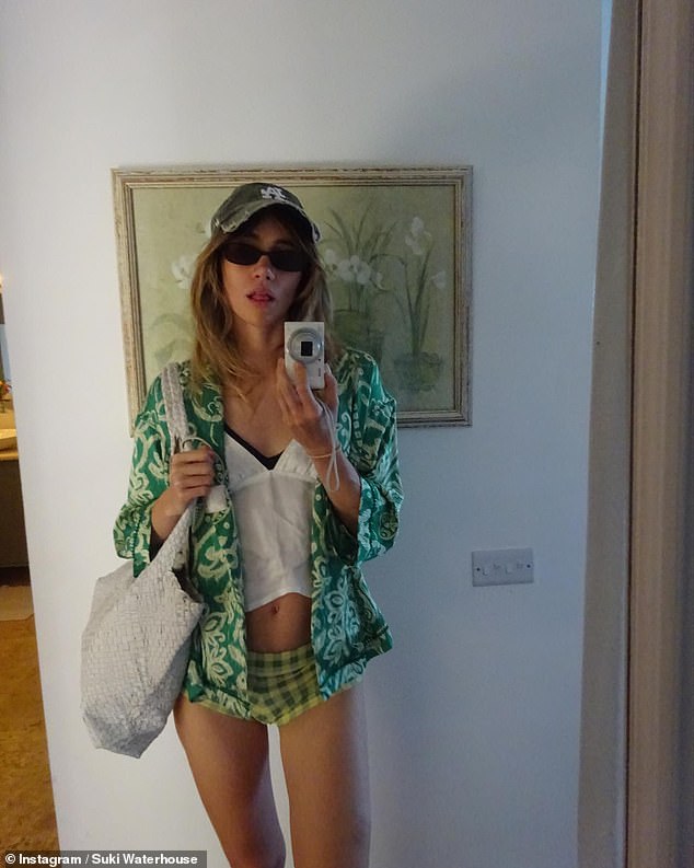 Finally, Suki included a stunning mirror selfie taken on her digital camera, as she flaunted her taut stomach in a white cami top